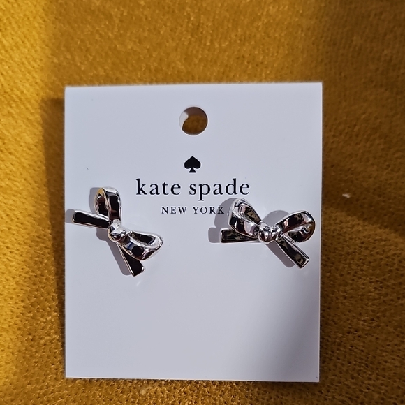 Kate Spade Silver Skinny Mini Bow Stud Earrings W/Dustbag NWT - Picture 1 of 4